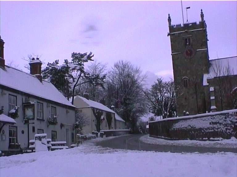 The White Swan and Church in Winter